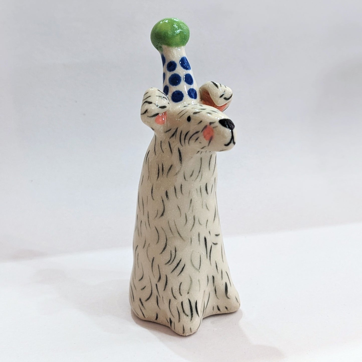 Ceramic dog with party hat