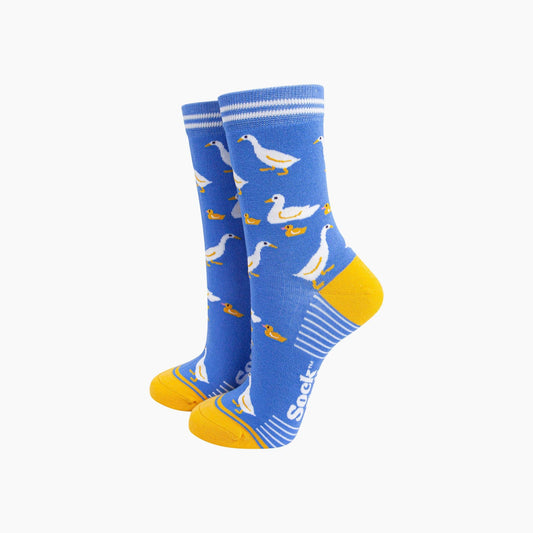 Blue socks with duck pattern and yellow toes on a white background