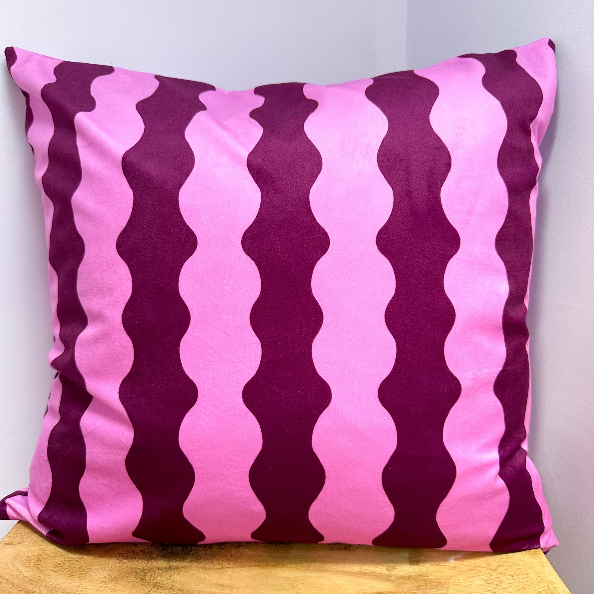 68de2f7800ddcb1087155c2d_burgundy-and-pink-wavy-cushion_1760525005719.jpg