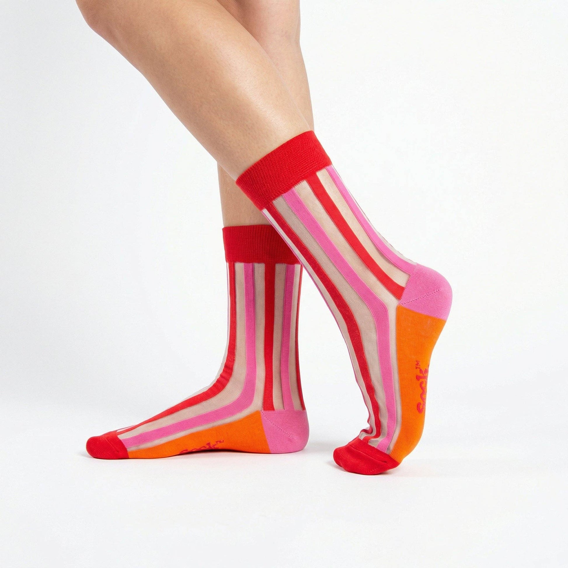 Colorful striped socks worn by a person on a white background