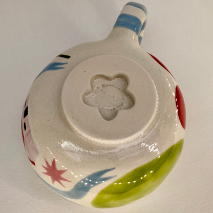 Ceramic bowl with colorful designs on a white background