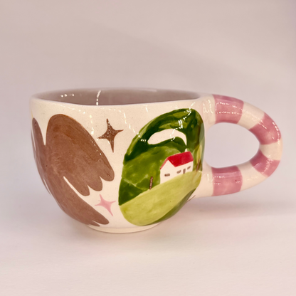 Ceramic mug with artistic design on a plain background