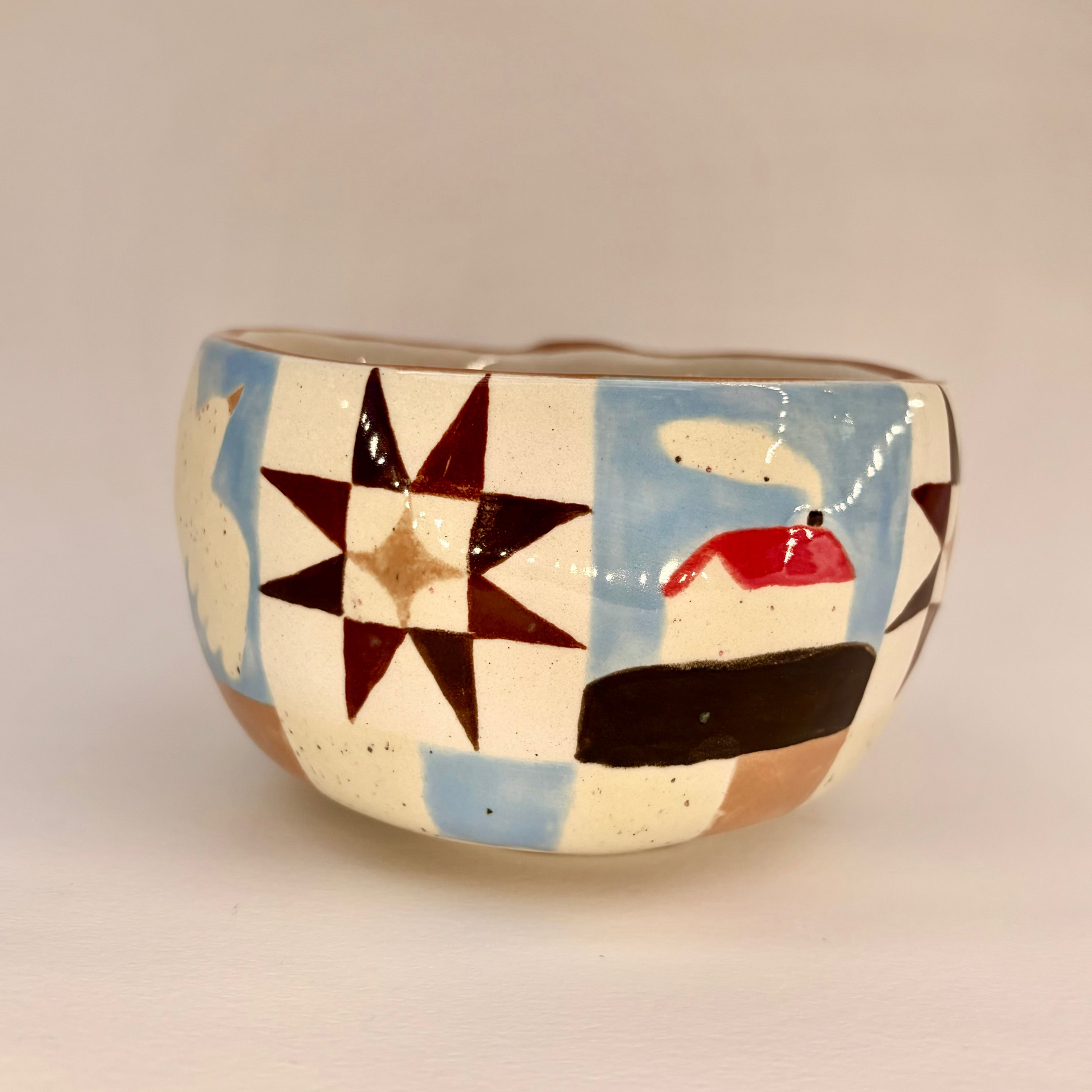 Ceramic mug with geometric pattern on a beige background