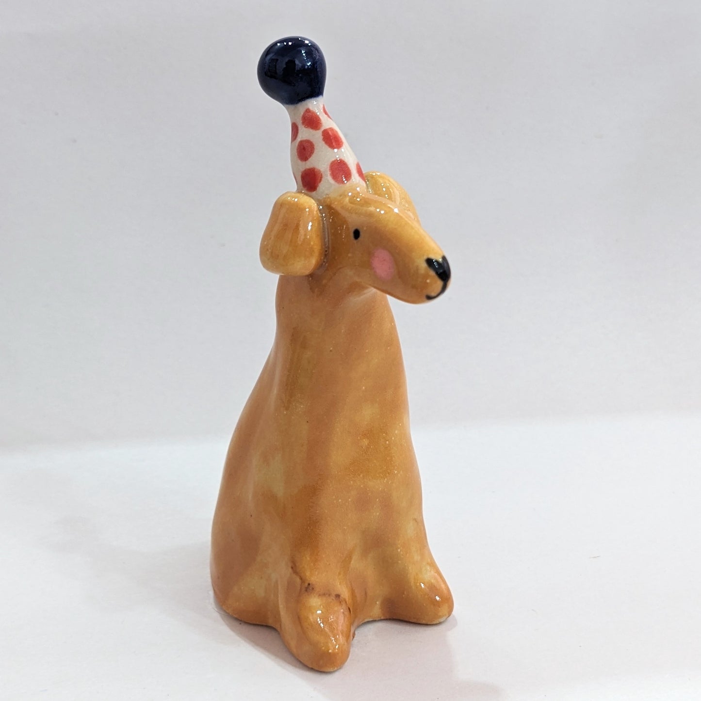 Ceramic dog with party hat