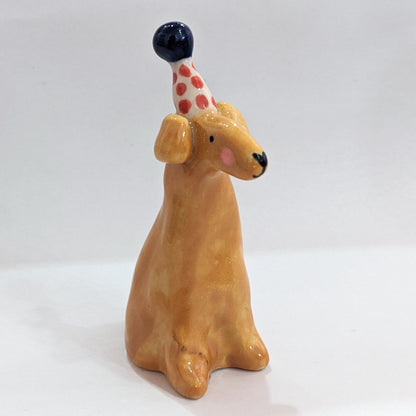 Ceramic dog with party hat