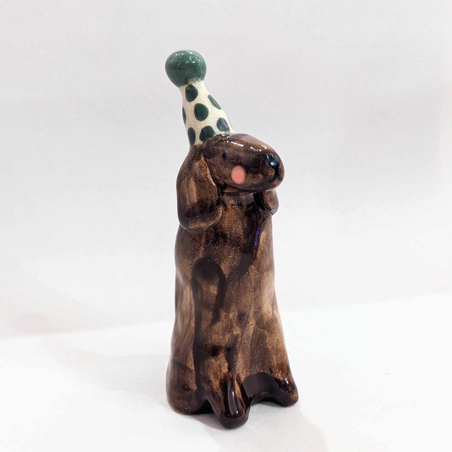 Ceramic dog with party hat
