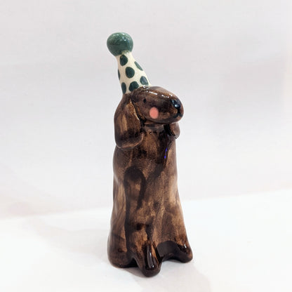 Ceramic dog with party hat