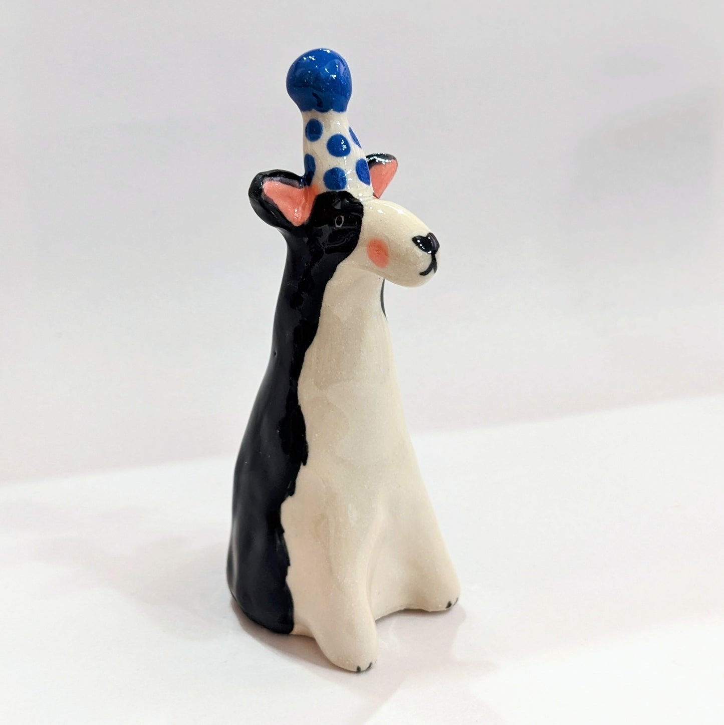 Ceramic dog with party hat