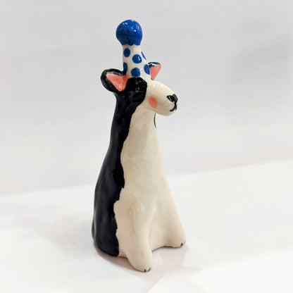 Ceramic dog with party hat