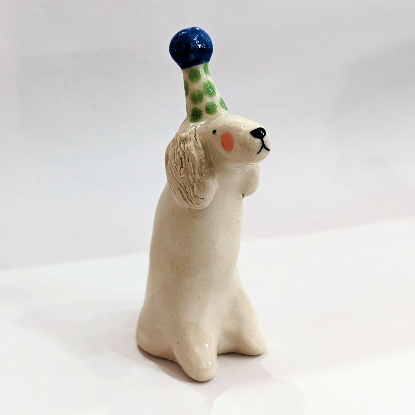 Ceramic dog with party hat