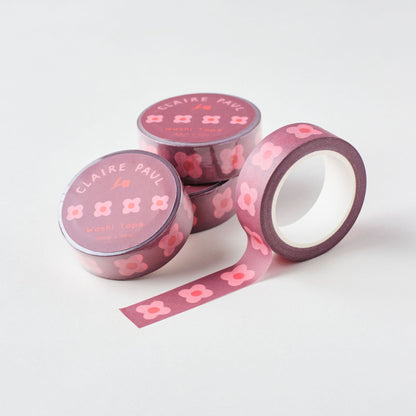 Rolls of tape with pink block flower print stacked against each other